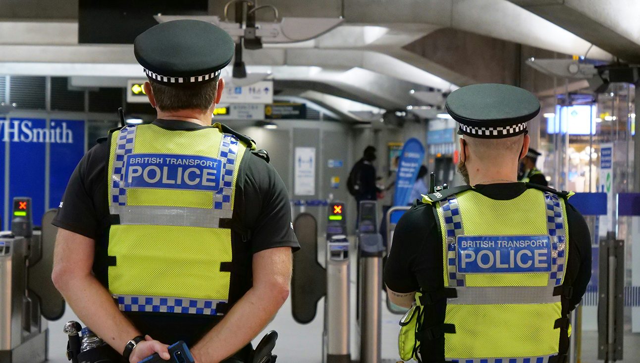 The backs of two Metropolitan Police Officers