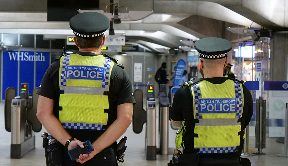 The backs of two Metropolitan Police Officers