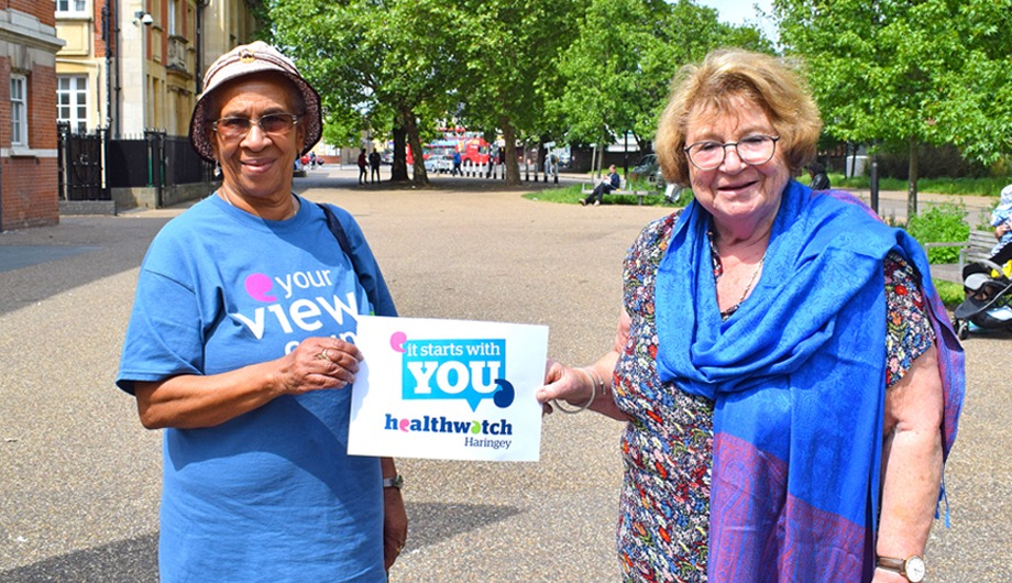 Healthwatch Haringey volunteers holding Healthwatch sign