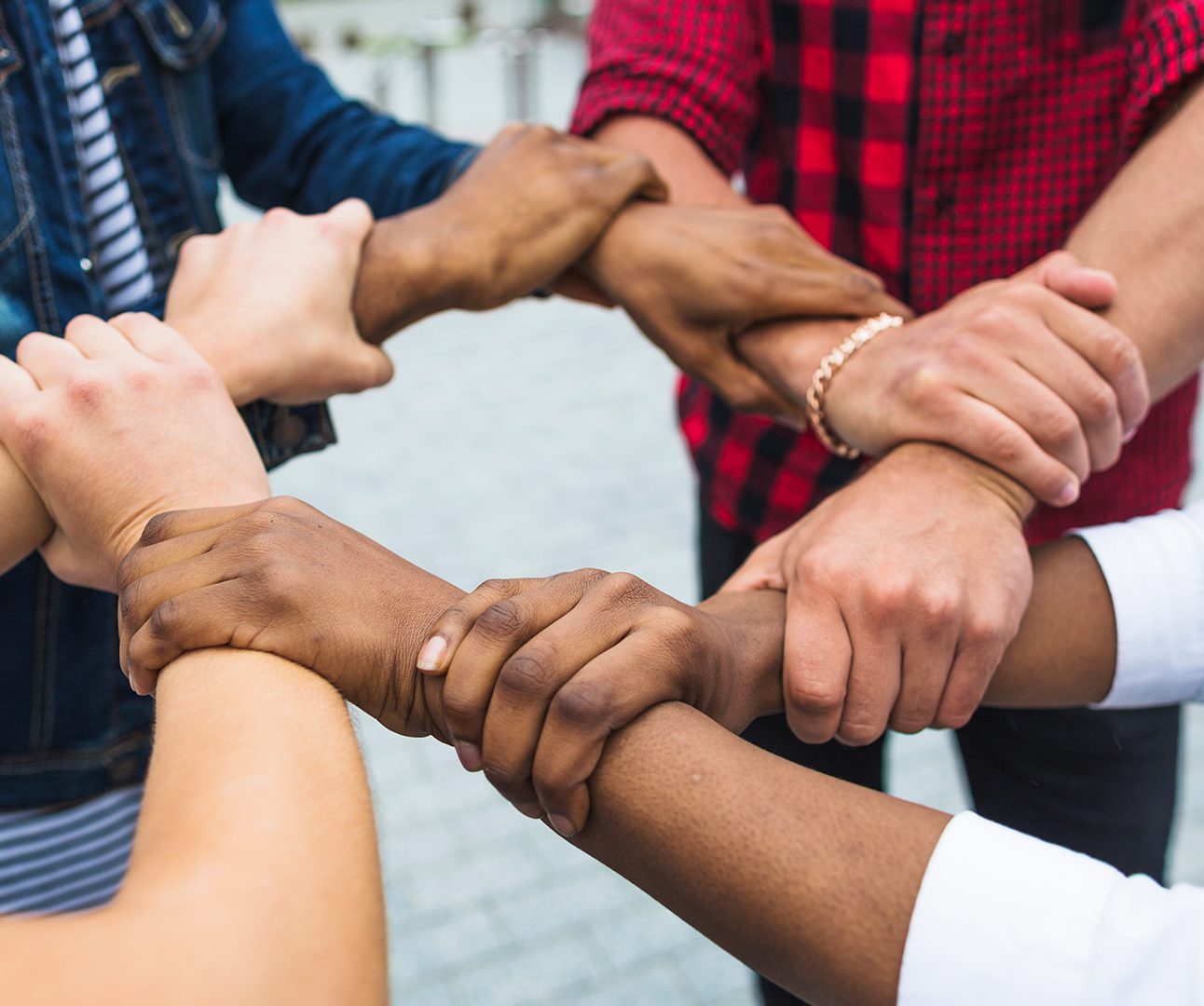 Mixed Group Locking Arms to Show Unity