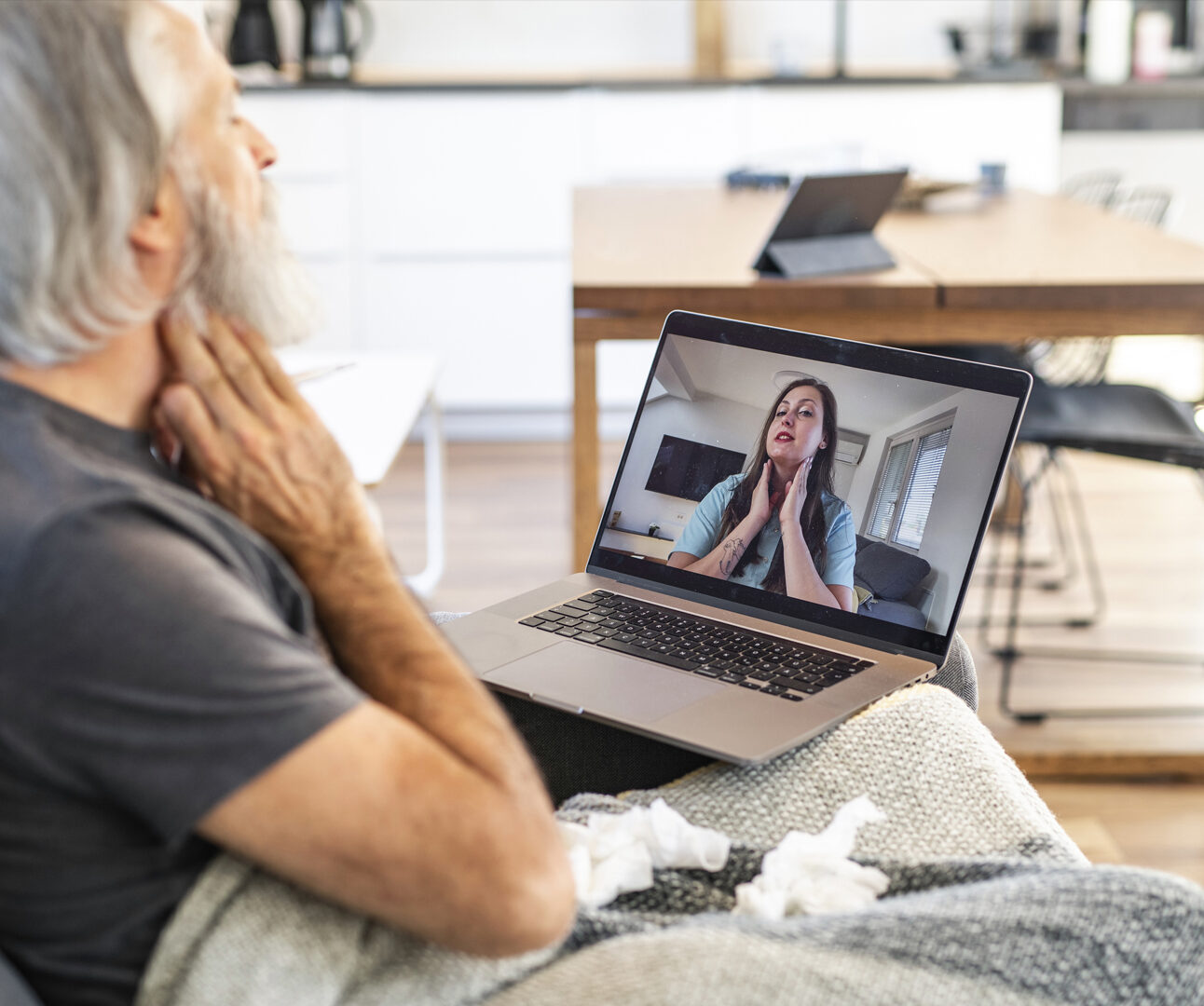 White Man Online Meeting with GP on Laptop From Home